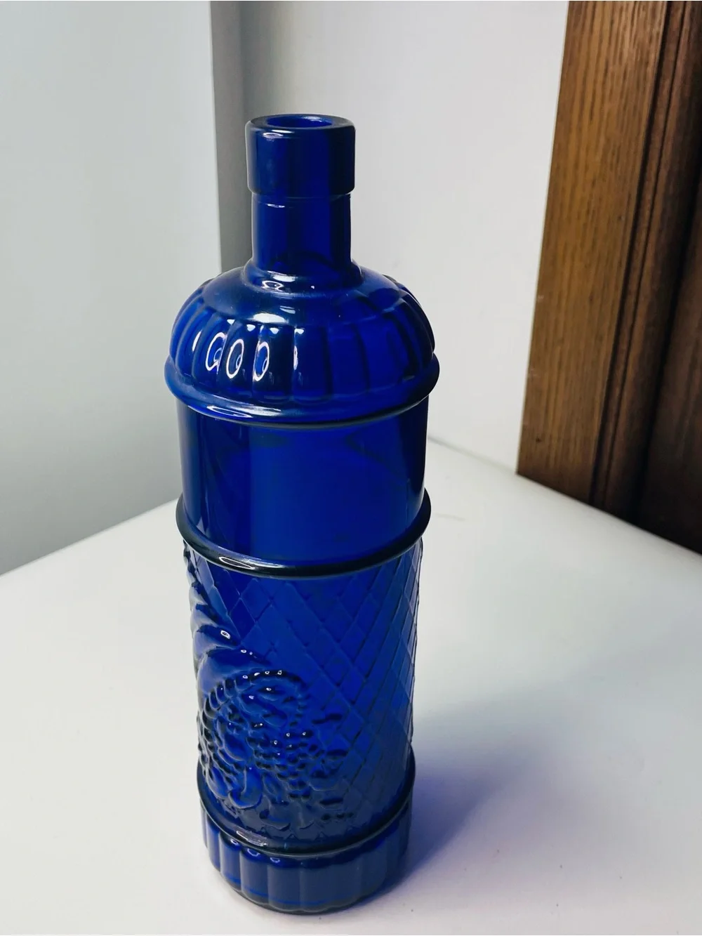 Vintage Colbalt blue glass bottle embossed cornacopia from Spain